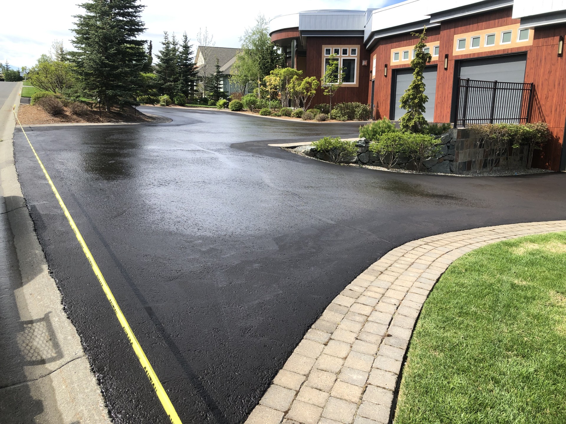 Fresh sealcoating finish on asphalt driveway