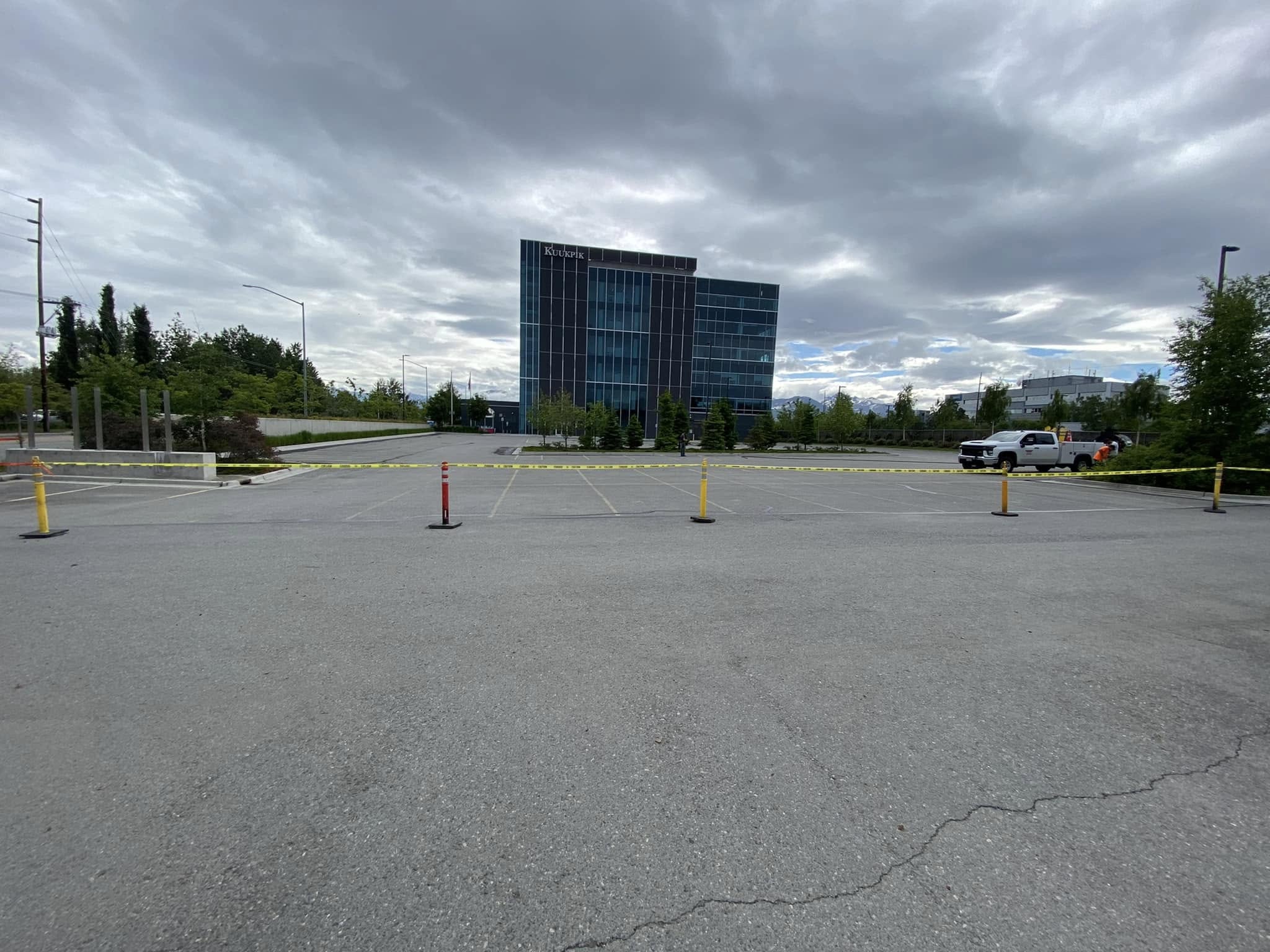 Crew performing crack sealing on parking lot